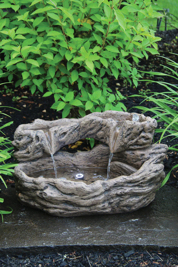 Timber Creek Log Fountain brings a natural organic charm to any garden