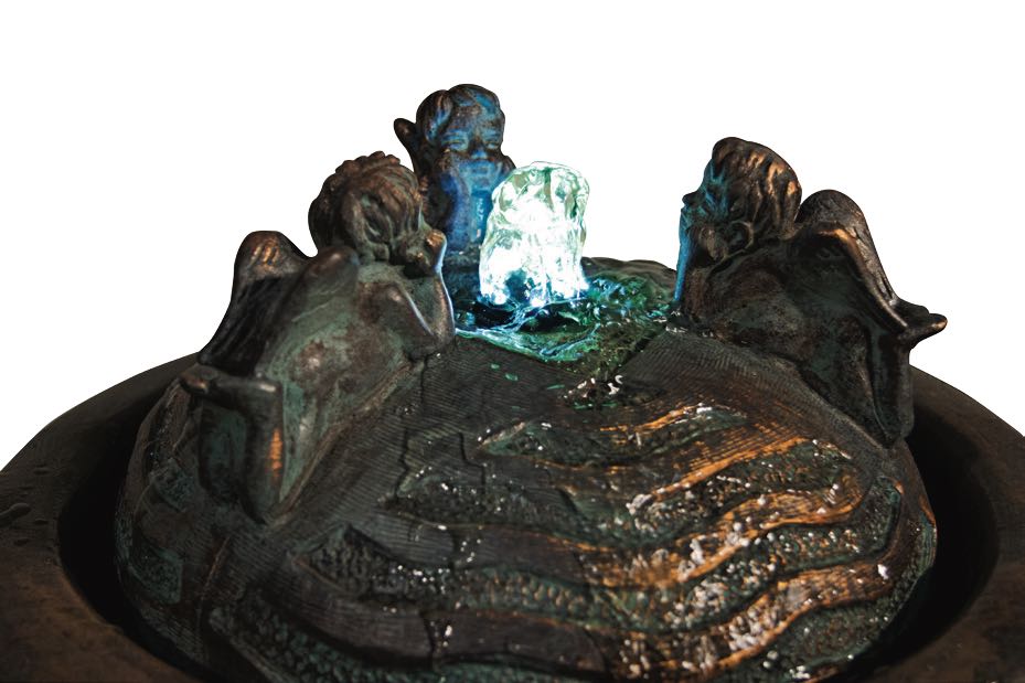 Close up of Cherub Trio Bubbler Garden Fountain watching the flow of water lighted feature