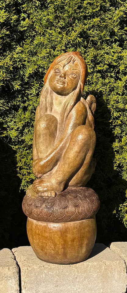 Children of the Forest girl garden sculpture sitting on acorn base statue