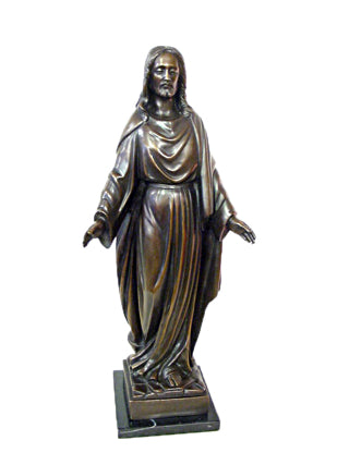 A bronze-finished statue of Jesus Christ with outstretched hands, standing on a dark rectangular base against a plain white background.