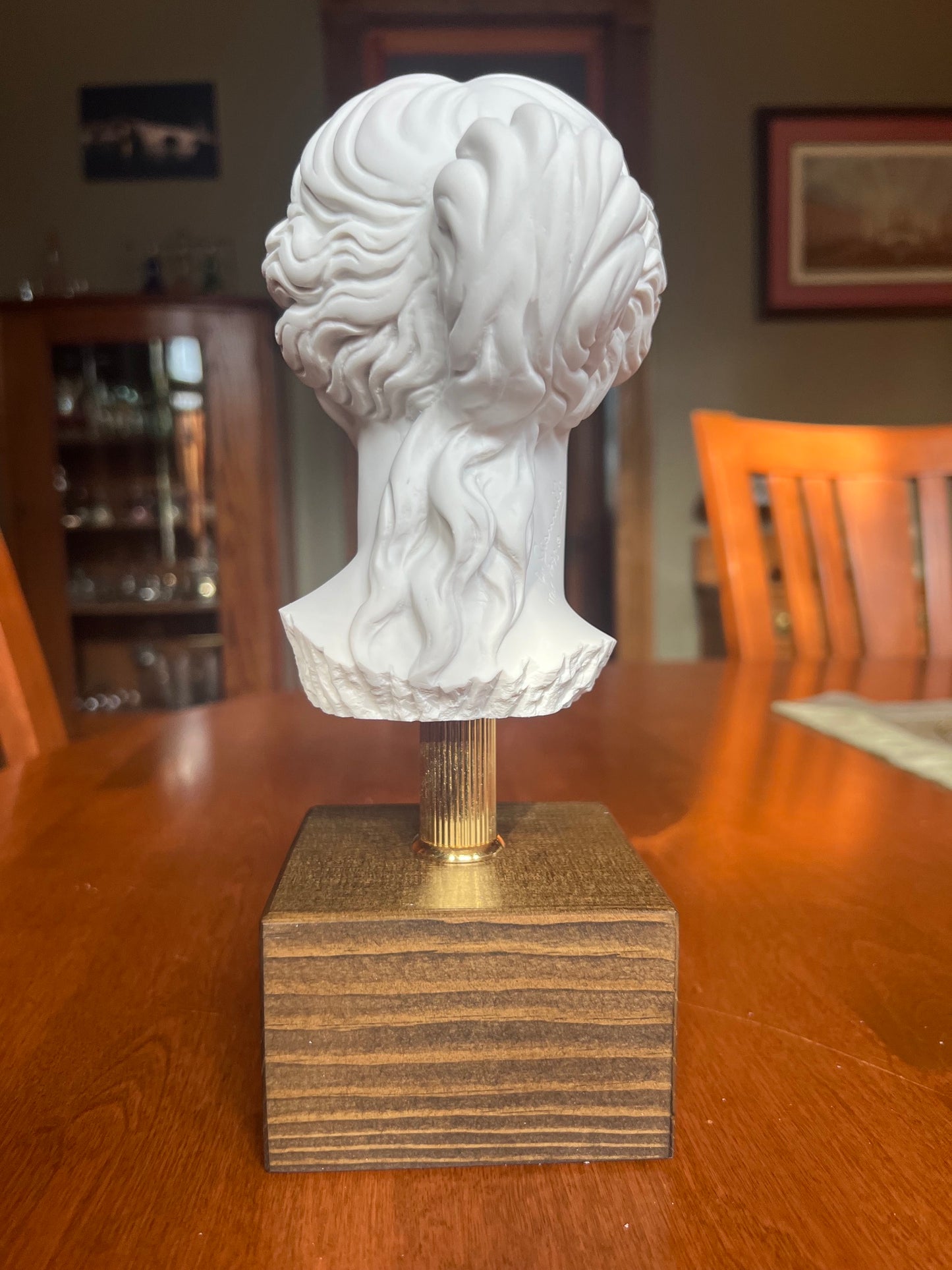 Classical Venus bust mounted on metal rod and wood base back view