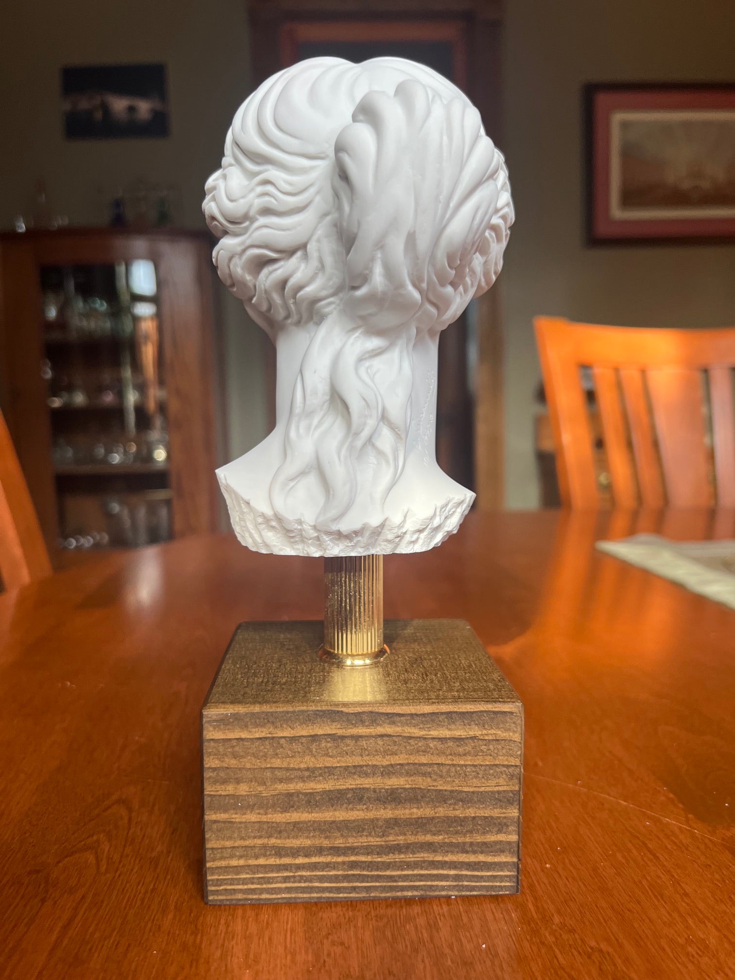 Classical Venus bust mounted on metal rod and wood base back view