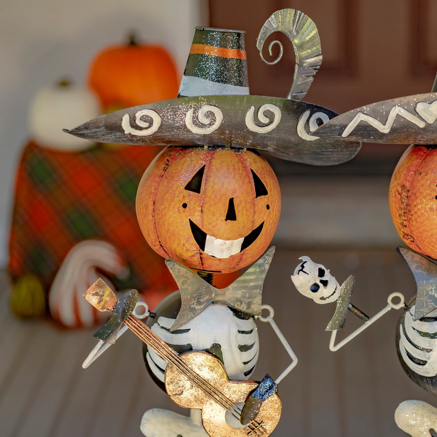 Colorful iron mariachi skeleton figurines for seasonal display playing guitar