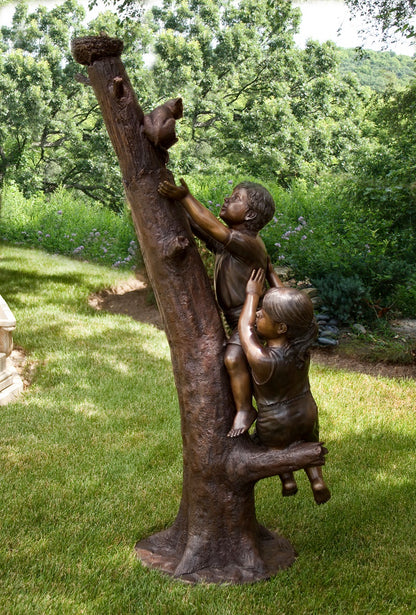 Bronze Statue of boy and girl rescuing cat from tree sculpture life-size