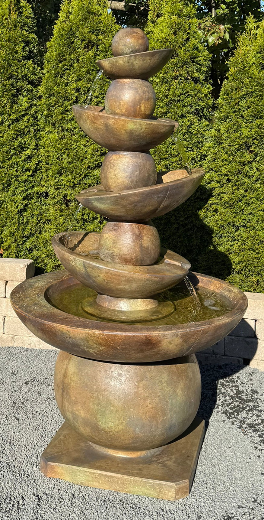Contemporary cascading fountain with stacked spheres and bowls