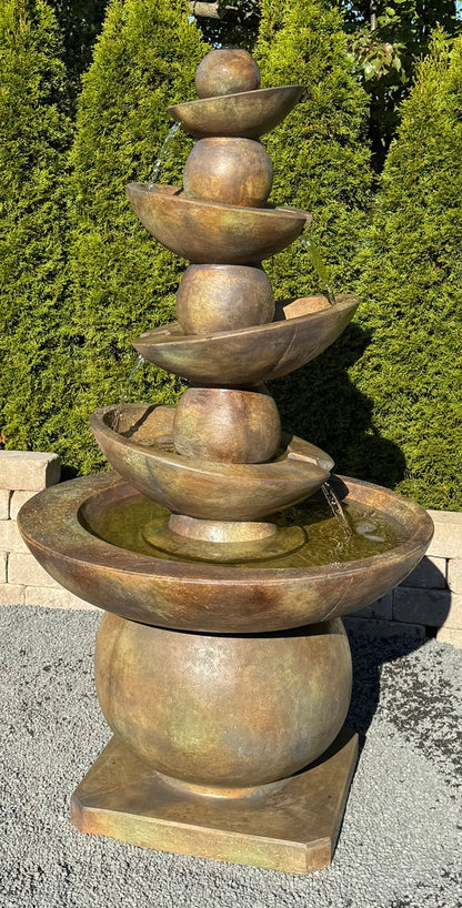 Contemporary cascading fountain with stacked spheres and bowls