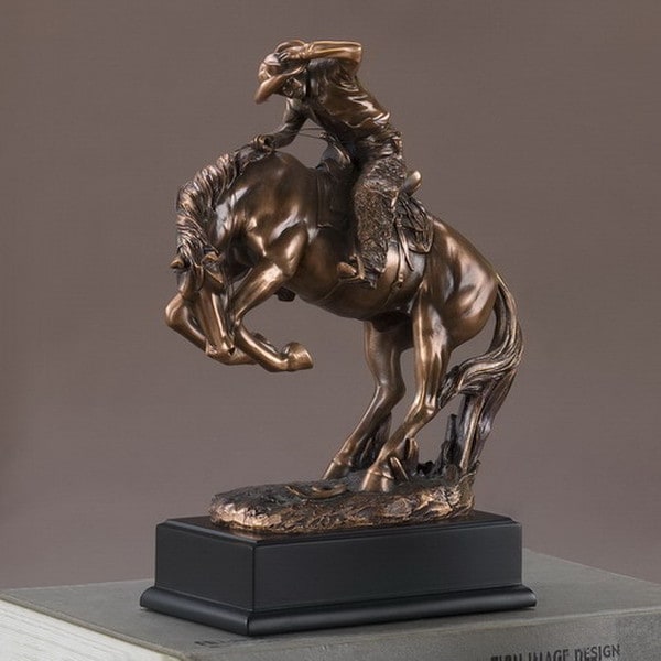 Cowboy breaking stallion sculpture recreates the wild old West Figurine