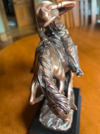 Cowboy riding a spooked stallion with snake on the base top view