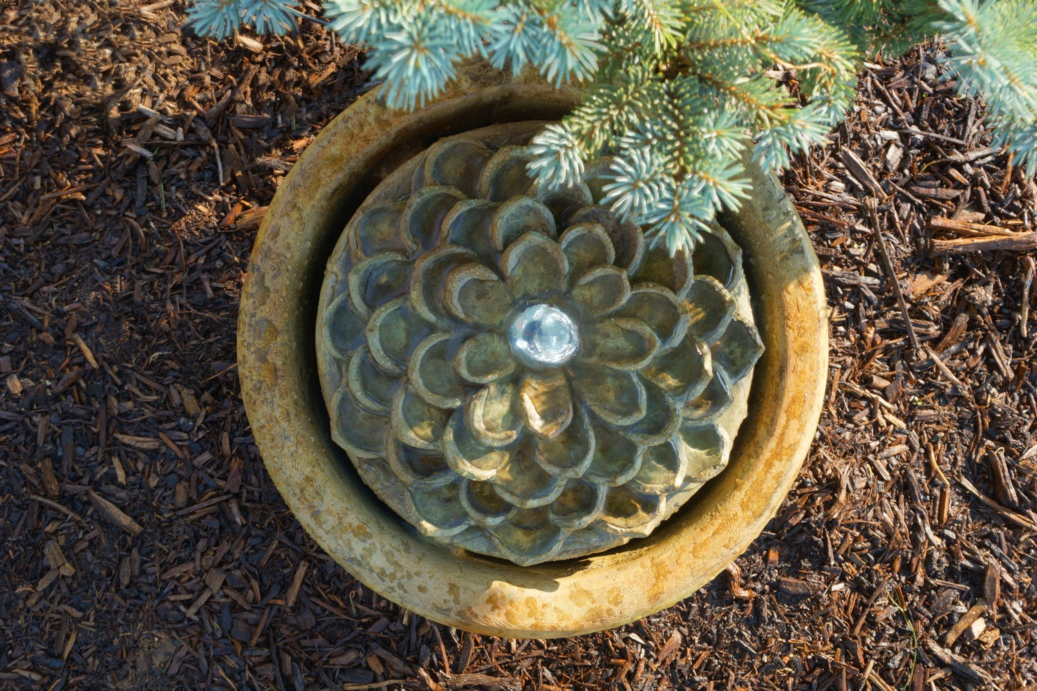 layered beauty of a blooming dahlia flower patio bubbler fountain brings a soft tranquil presence to your garden