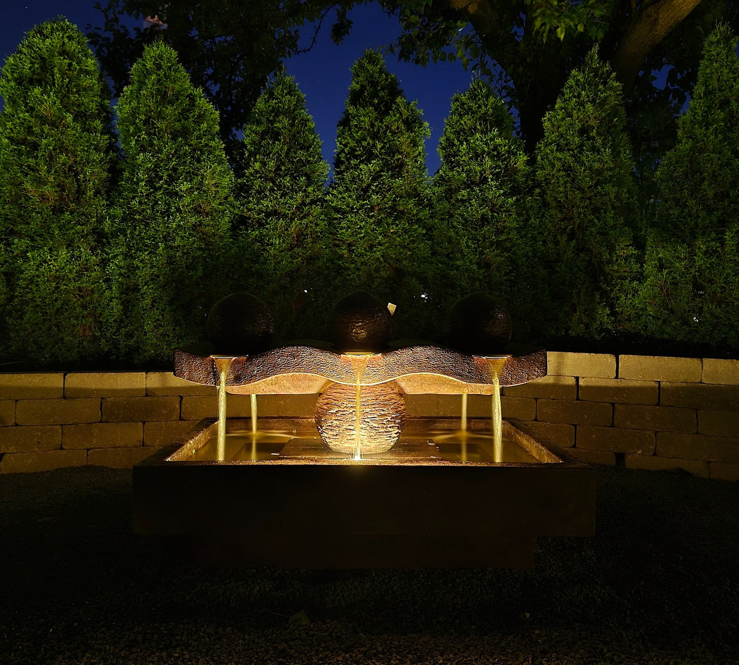 Dancing Spheres Modern Fountain Estate Size 3 balls lighted shown at night with light on