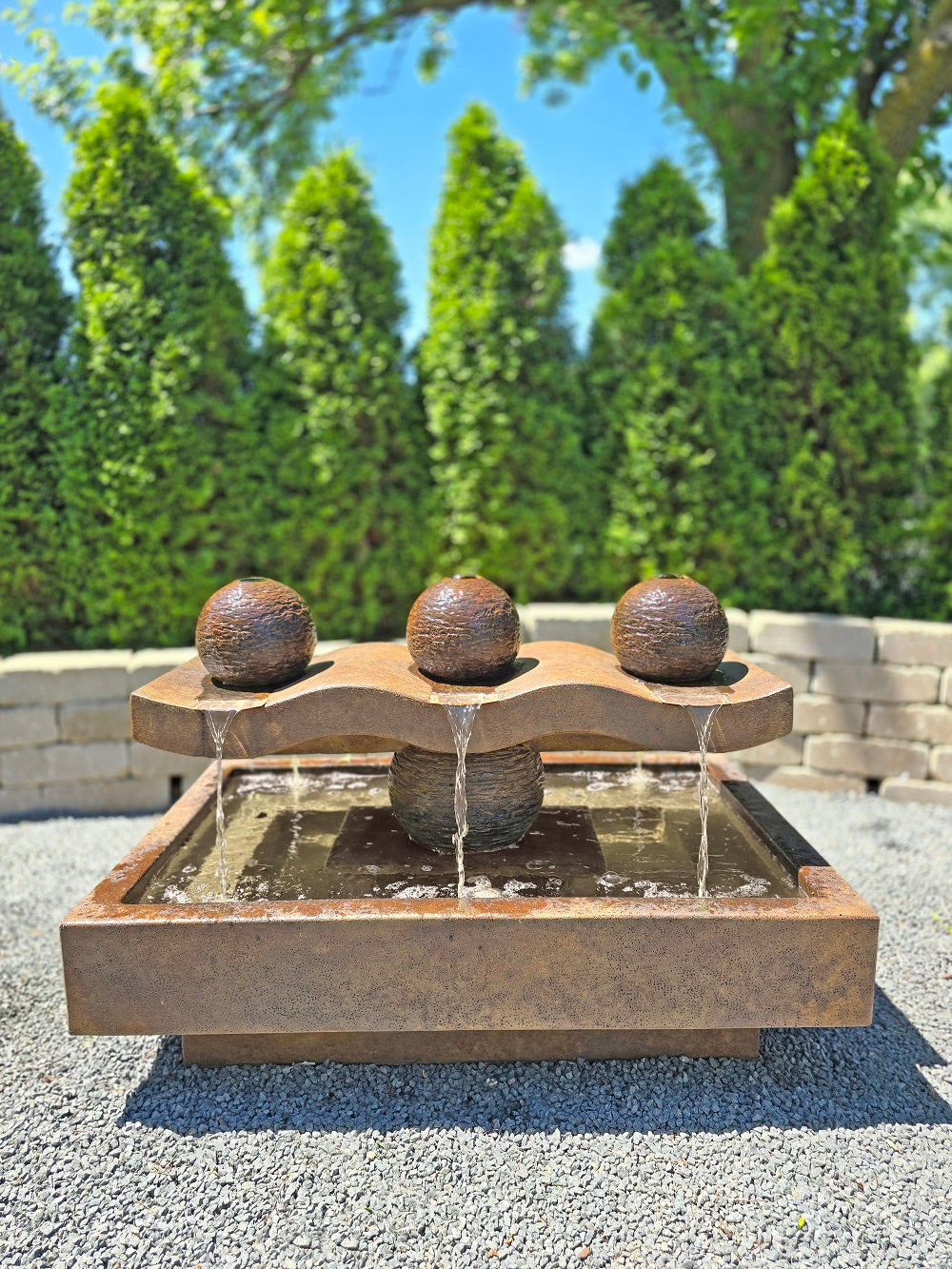 Striking modern design with three textured sphere elements architectural outdoor fountain three spheres