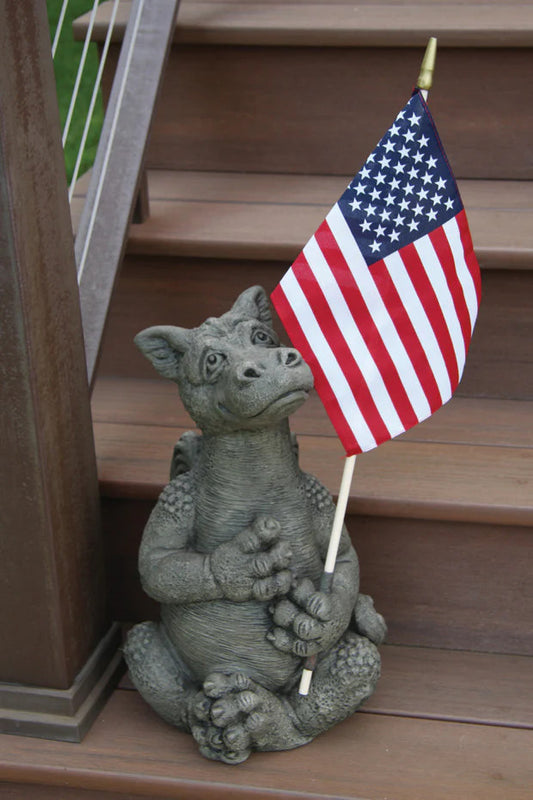 Statue of a dragon creature holding an American flag on wooden steps