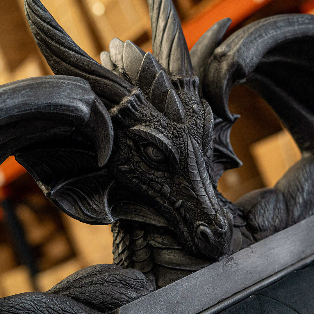 Close-up of a detailed dragon statue with a blurred background