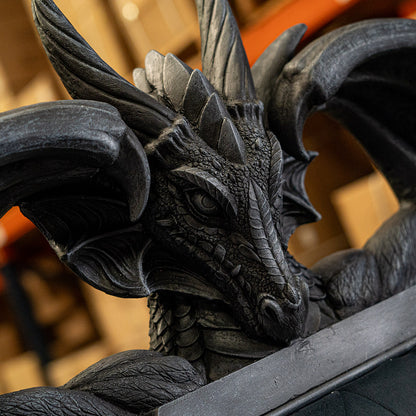 Close-up of a detailed dragon statue with a blurred background