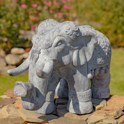 Side view decorative elephant garden statue with ornate carved detailing