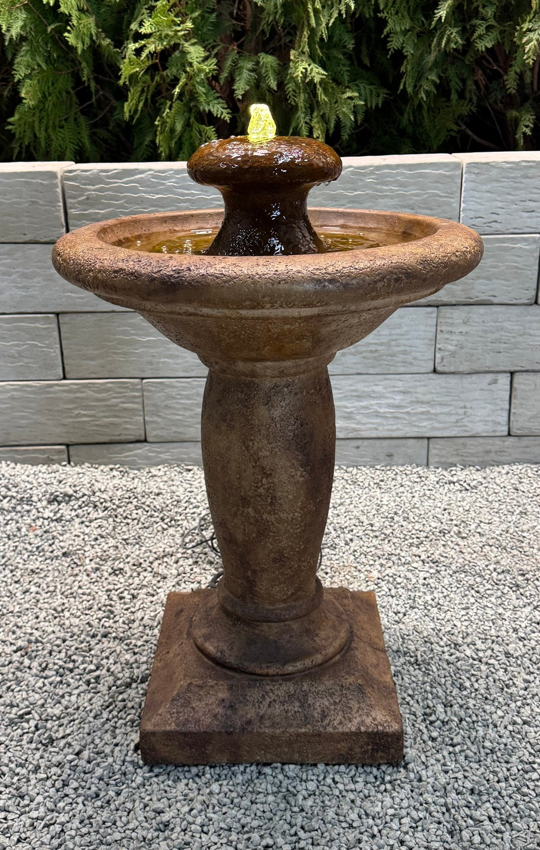 Europa cast stone fountain with bubbling water feature lighted