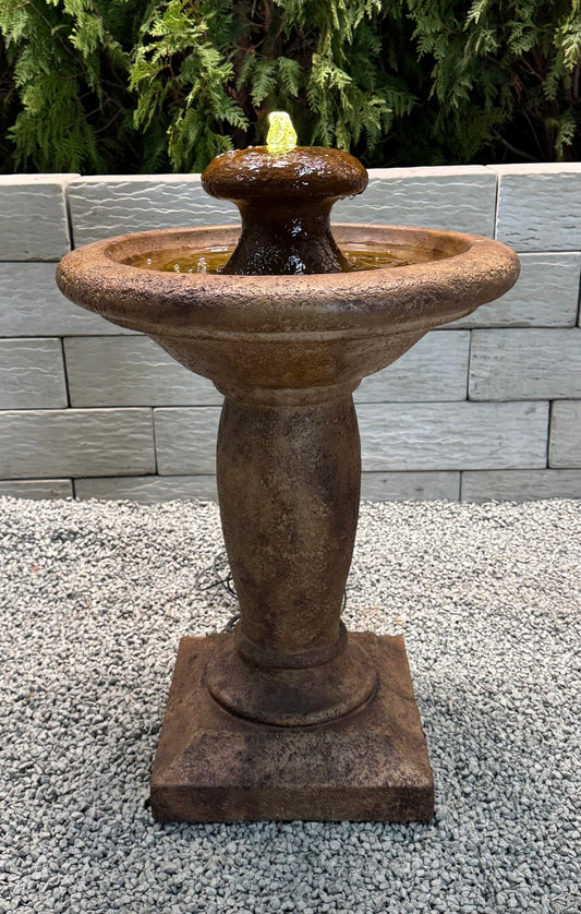 Europa cast stone fountain with bubbling water feature lighted