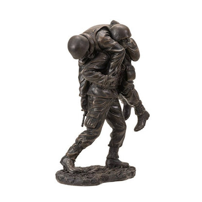 sculpture portrays a compassionate soldier carrying a wounded comrade from the battlefield