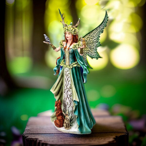 Adorned with a leafy headdress and antlers this sculpture magical beings