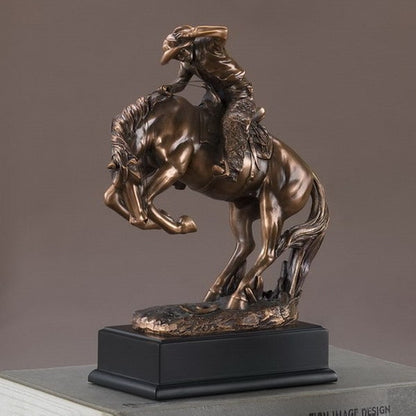 Cowboy breaking stallion sculpture recreates the wild old West Figurine