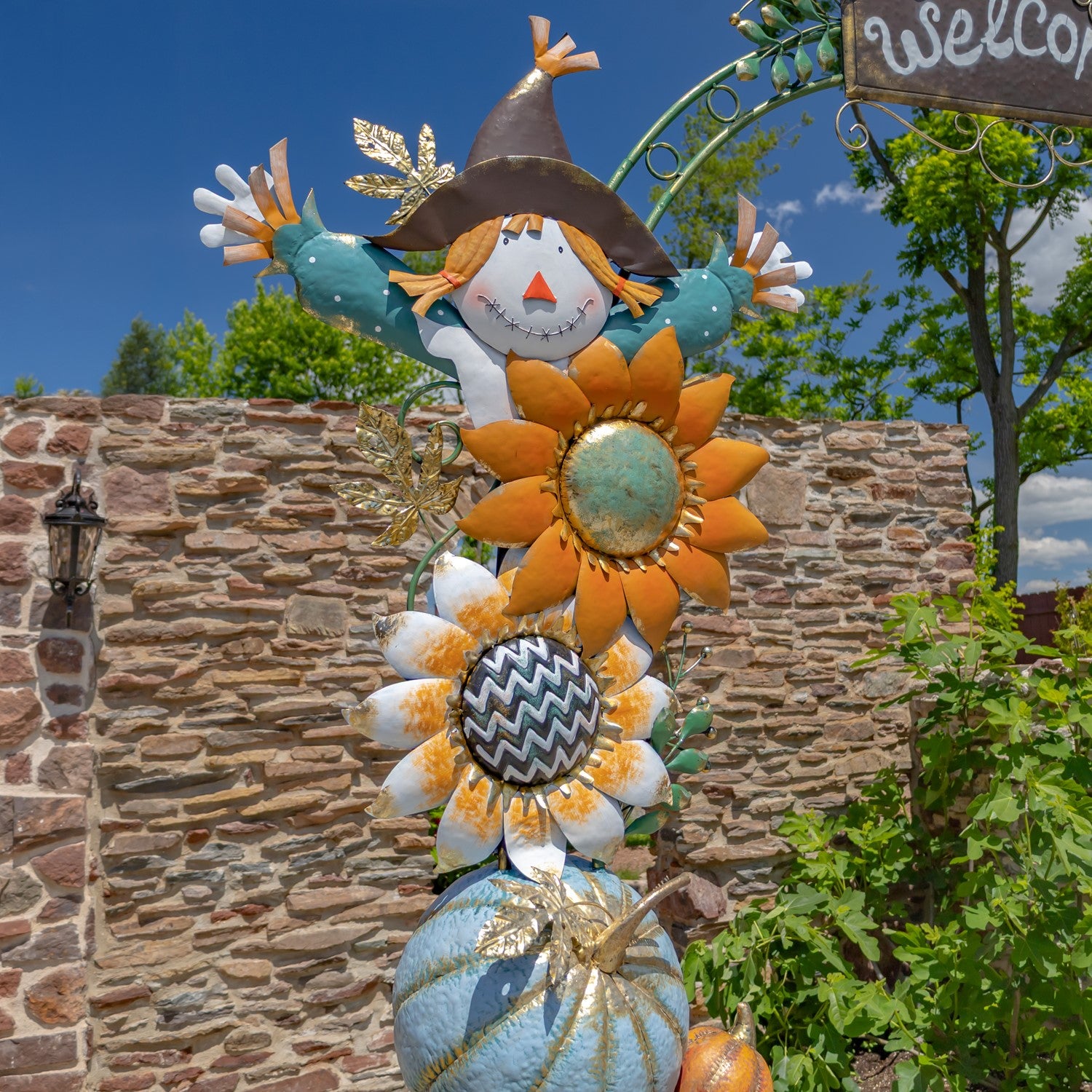 Fall Festival Pumpkin and Sunflower Arch showing scarecrow pumpkin and sunflowers