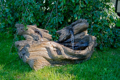 naturalistic cascading fallen logs garden fountain is sure to be the crowning statement