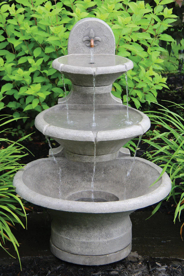 Fleur De Lis Tiered Wall Garden Fountain captures the refined beauty of French design with its graceful form and timeless detailing