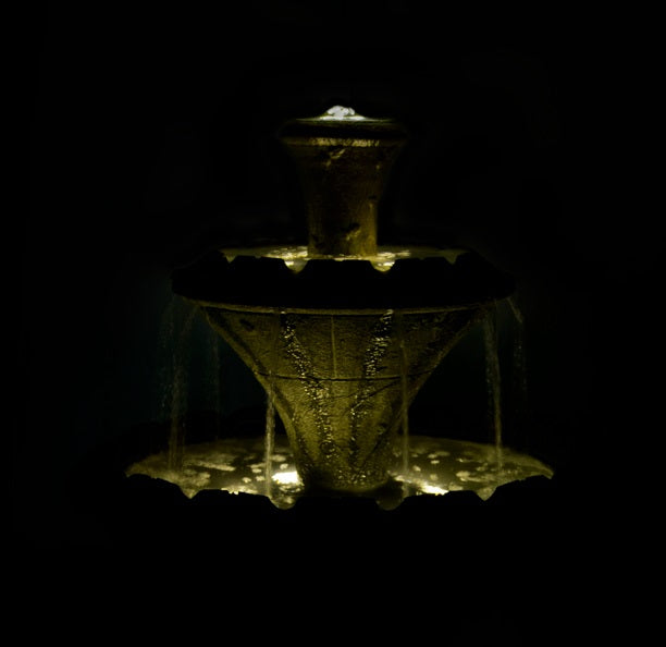 Flora Two-Tier Fountain flowers high relief on pedestal garden sculpture nighttime view lighted