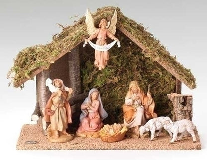 Nativity scene with figures including Mary, Joseph, and baby Jesus in a manger.