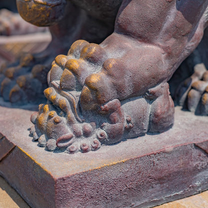 close up of paw Foo Dogs garden statues also known as Imperial Guardian Lions or Shish symbolized protection power and prosperity
