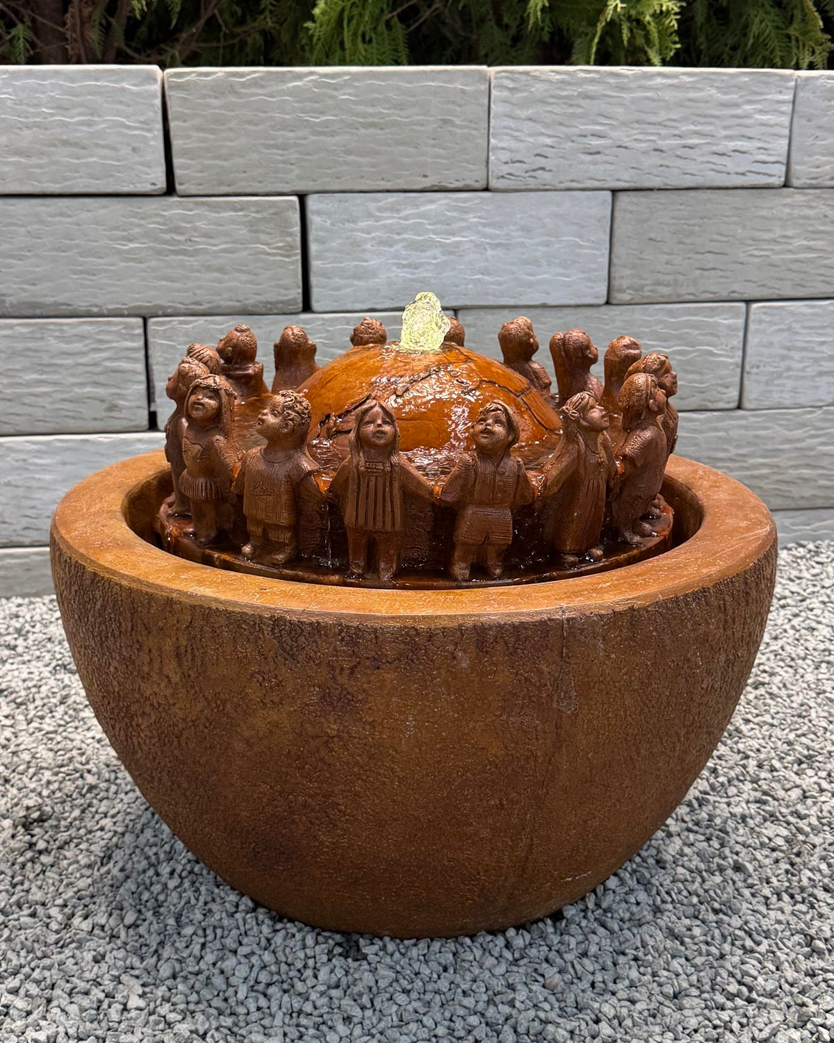 Children Garden Fountain with kids  circling and hold hands around the world