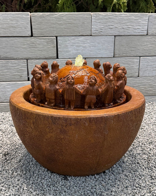 Children Garden Fountain with kids  circling and hold hands around the world