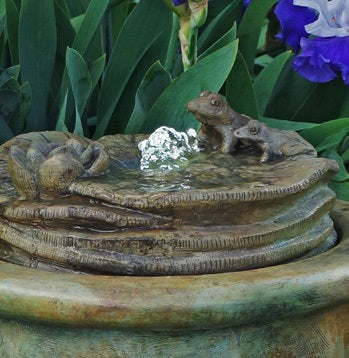 Whimsical lighted frog fountain for garden and flower bed display