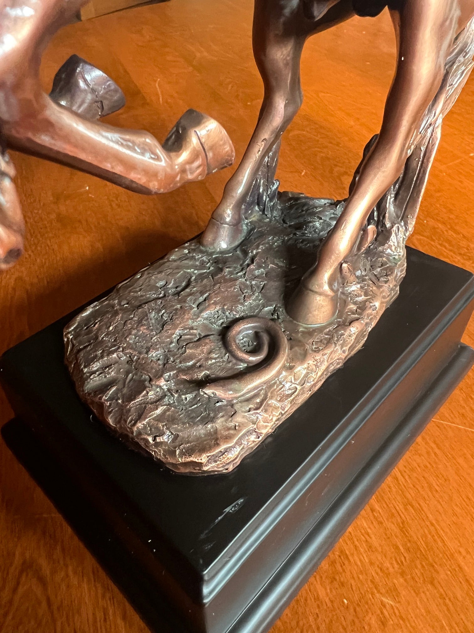 Close up of snake under the Spooked Stallion Cowboy Sculpture