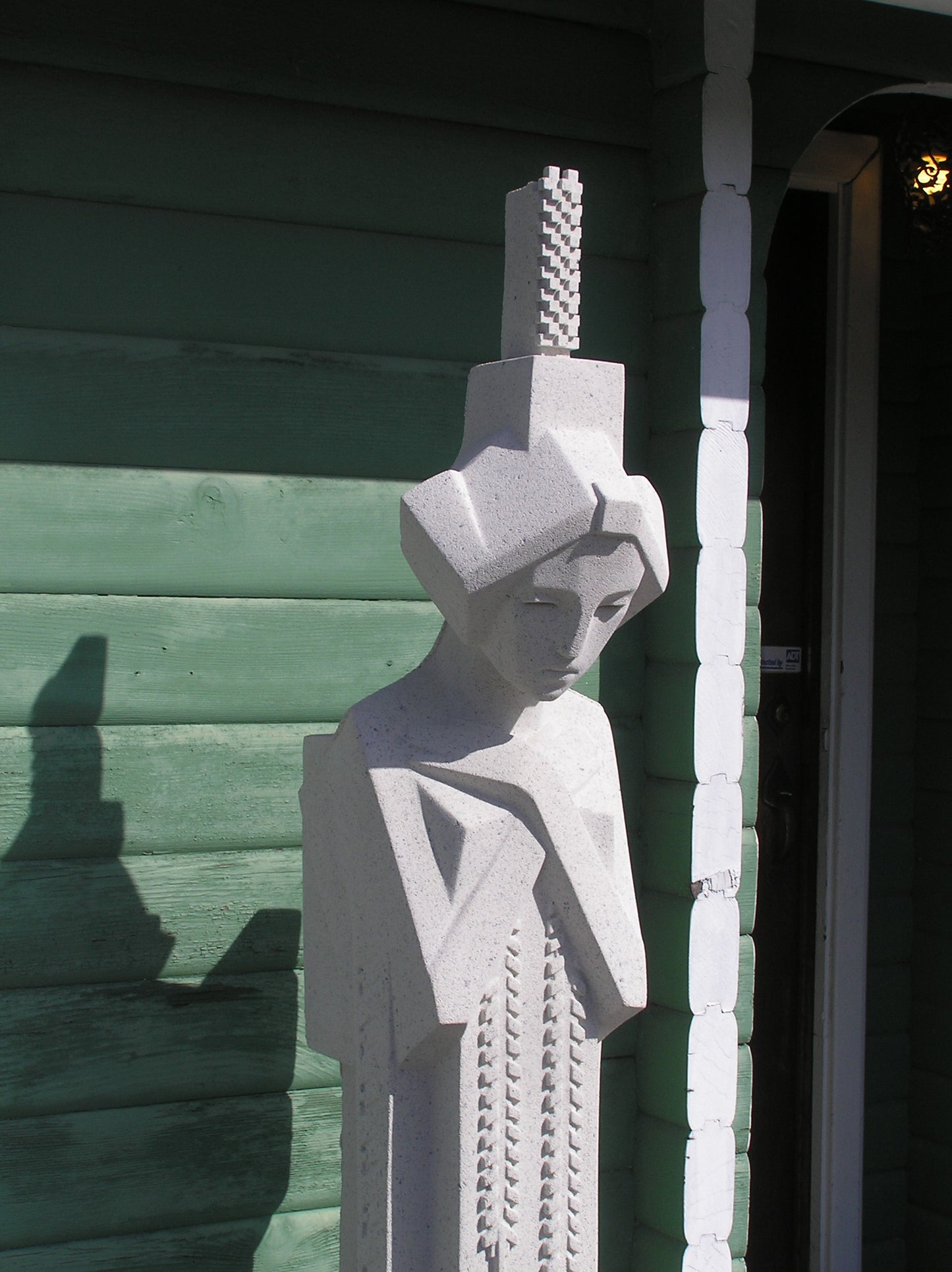 Close up of Face Garden Sprite With Comb Estate Statue by Frank Lloyd Wright