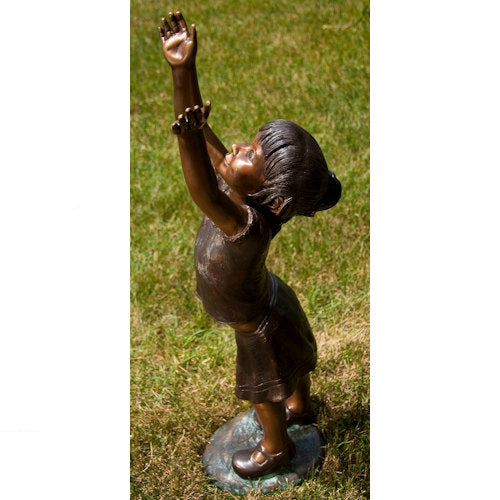 joyful imagination with this Girl Reaching for the Sky Bronze Statue