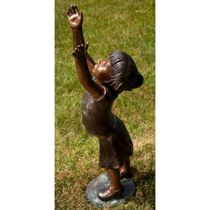 joyful imagination with this Girl Reaching for the Sky Bronze Statue