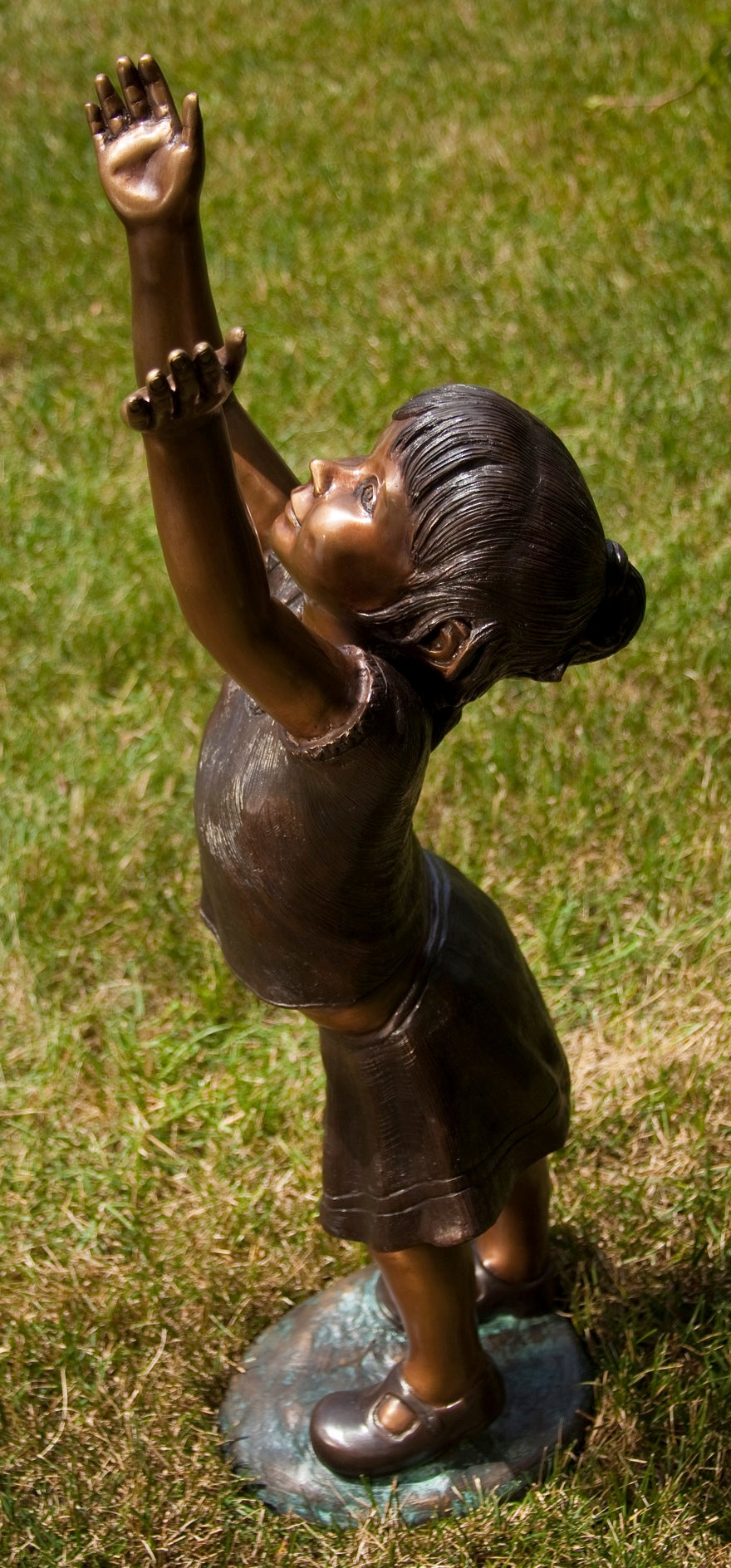Girl Reaching for the Sky Bronze Statue Side view of sculpture