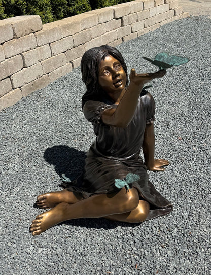 Girl with Butterflies Bronze Garden Statue captures a magical childhood side view