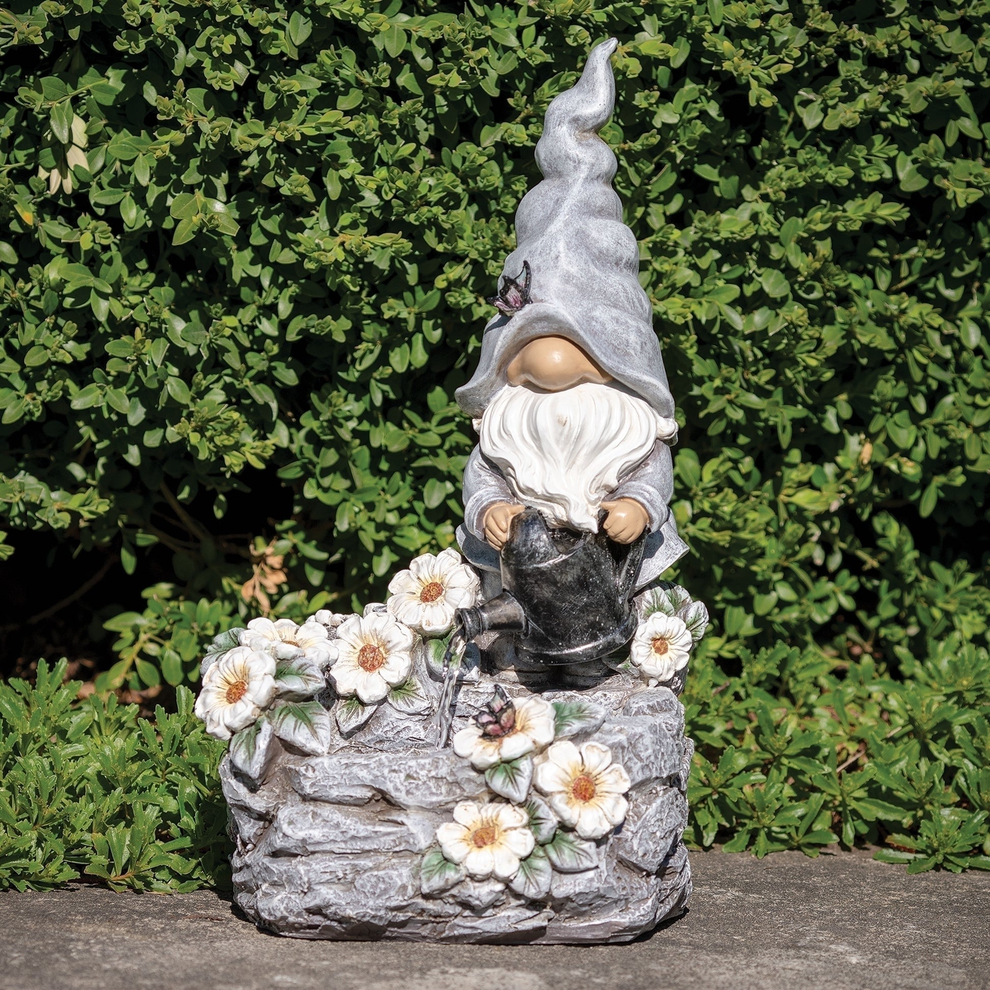 Gnome garden fountain sculpture holding watering can with flowers and butterflies