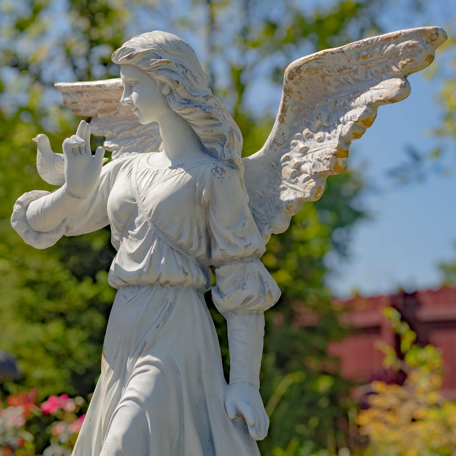 Timeless Winged Angel Garden Statue with bird on arm large scale sculpture