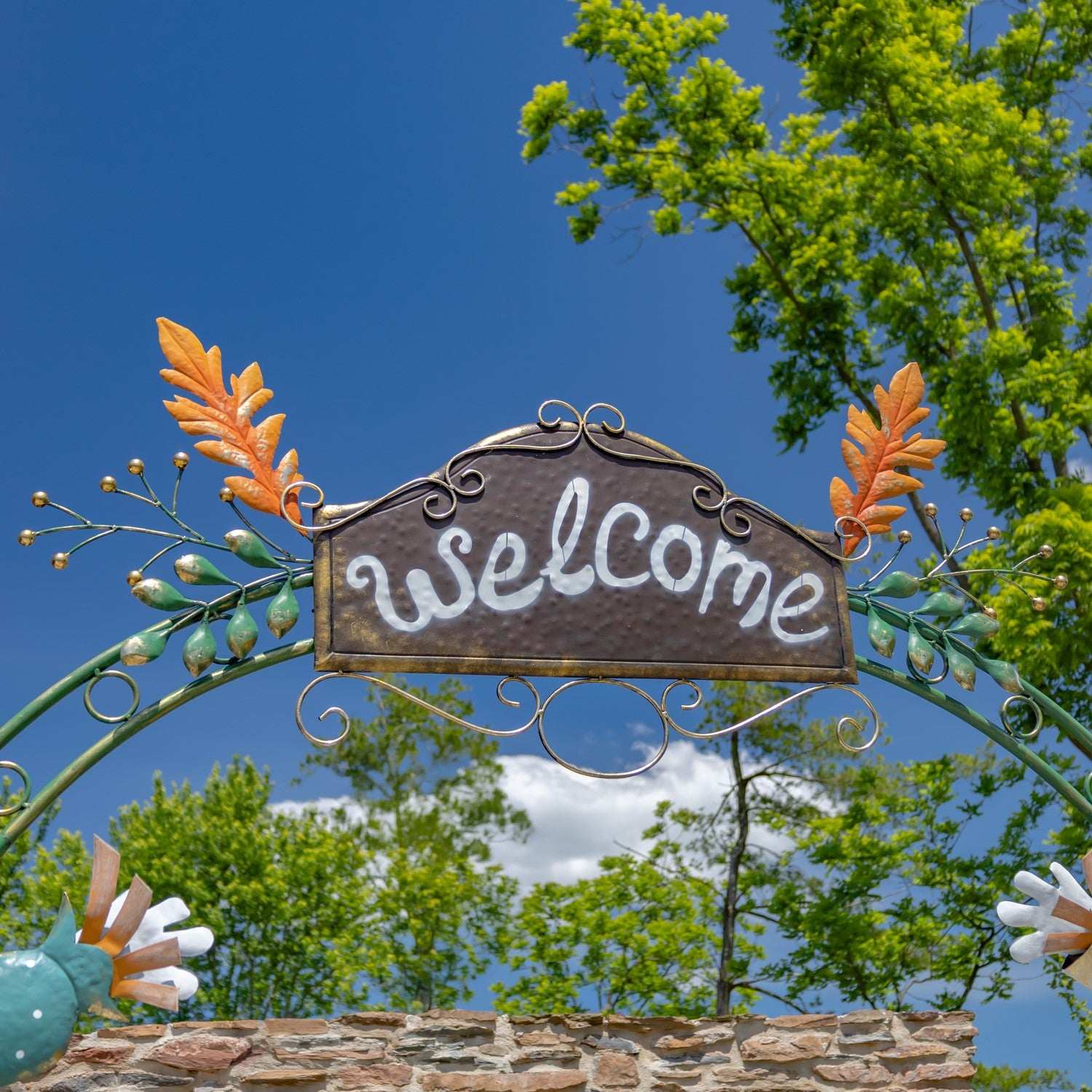 Grand Autumn Scarecrow and Pumpkin Archway close up of the Welcome sign