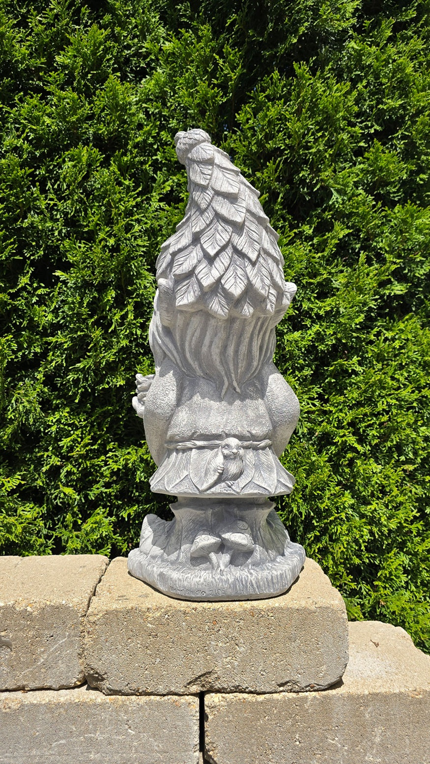 back view Green Man garden sculpture with mushrooms at base