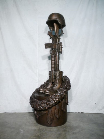 War Memorial one battle cross boots gun and helmet memorial statues