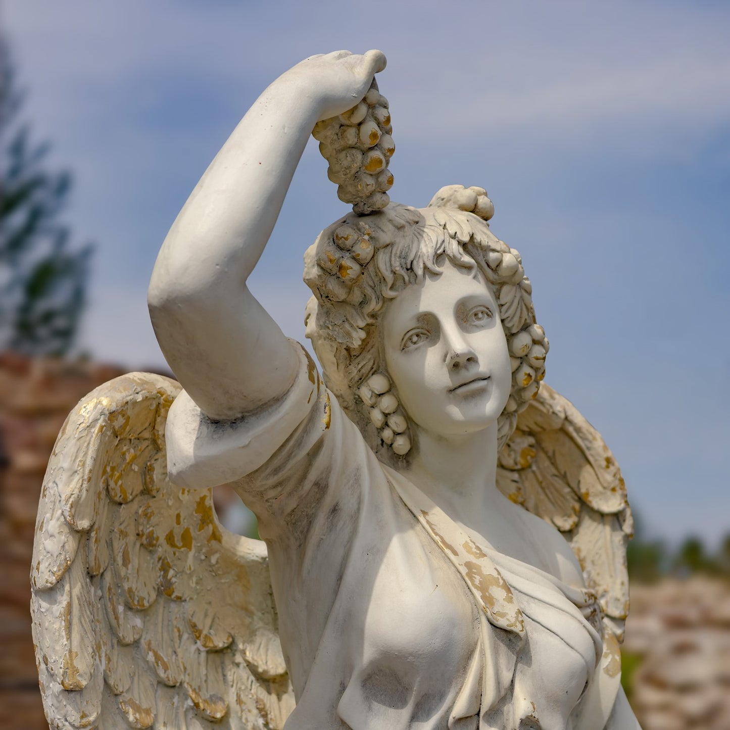 Close up of grapes and face side view Angel of the Harvest Life-Size Garden Statue