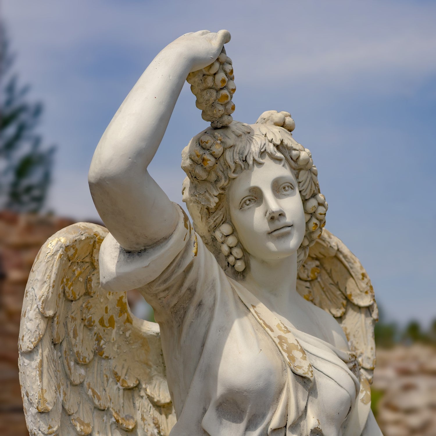 Close up of grapes and face side view Angel of the Harvest Life-Size Garden Statue