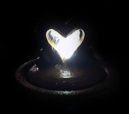 Two Hearts as One garden bubbler fountain with light kit nighttime view
