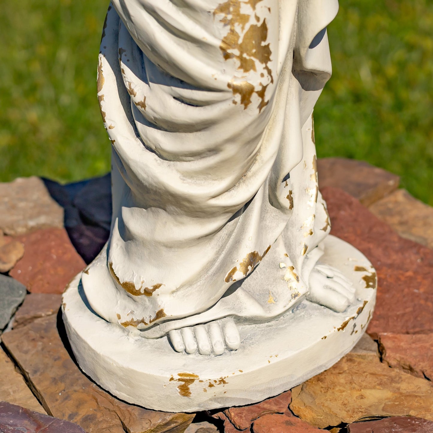 Base of Sculpture close up Tall Jesus with Sacred Heart Statue