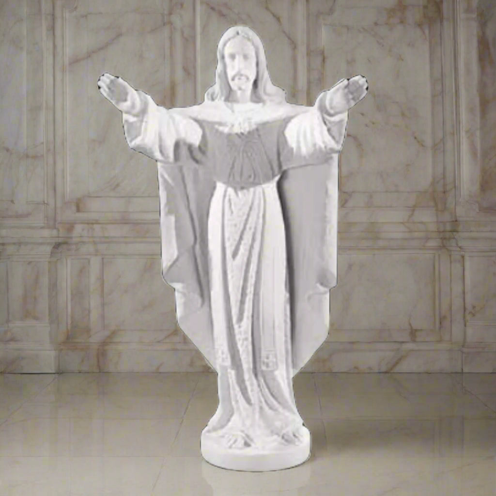 Collector-grade marble Jesus sculpture, life-size figure of Christ in blessing pose - White marble sculpture on a light brown background.
