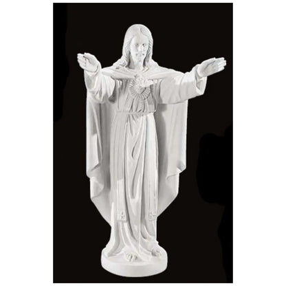 32-inch Sacred Heart of Jesus statue in Italian marble, displayed in a peaceful outdoor setting with manicured greenery and soft lighting